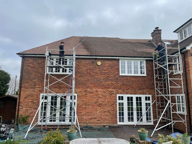 Roof cleaning carried out safely from scaffold towers by The Roof Moss Cleaners in Arlesey